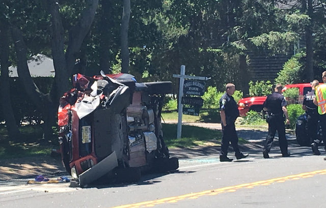 Cops: Woman suffers minor injury after vehicle overturns - Riverhead ...