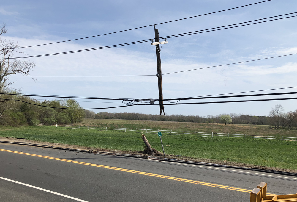 Cops: Truck pulls down power lines on Main Road, backing up traffic in ...