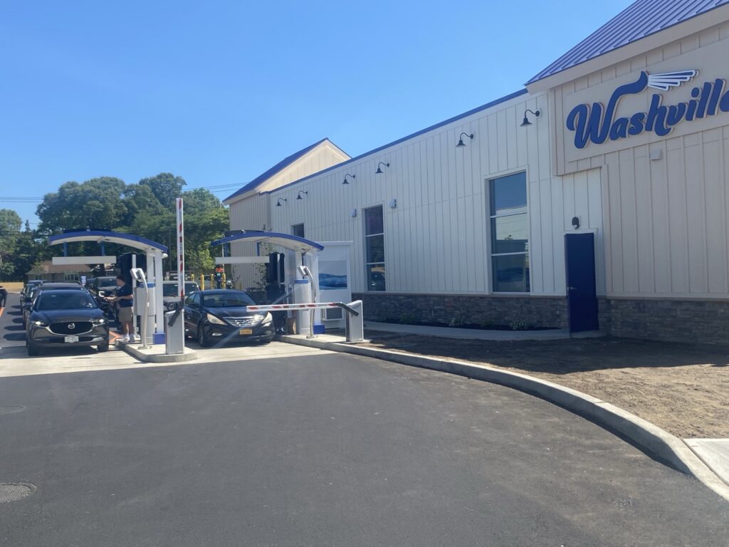Washville car wash entrance with cars in line.