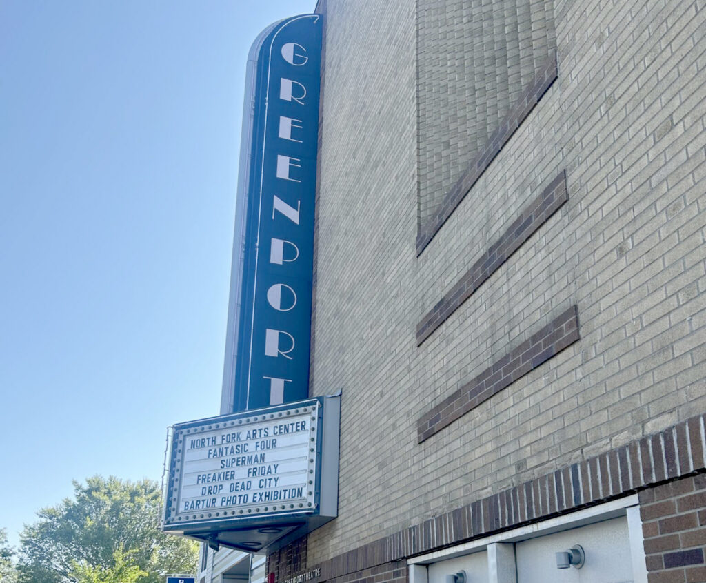 GREENDORT theatre marquee lists NORTH FORK ARTS CENTER events: FANTASIC FOUR, SUPERMAN, FREAKIER FRIDAY, DROP DEAD CITY, BARTUR PHOTO EXHIBITION.