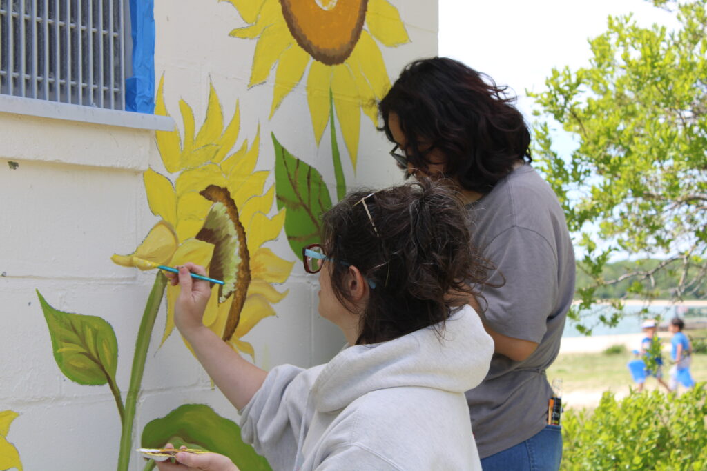 Greenport students kick off Fifth Street beach mural repainting project
