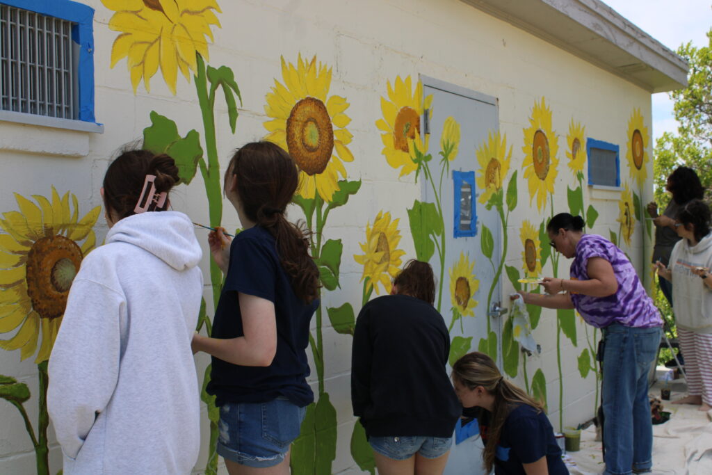 Greenport students kick off Fifth Street beach mural repainting project