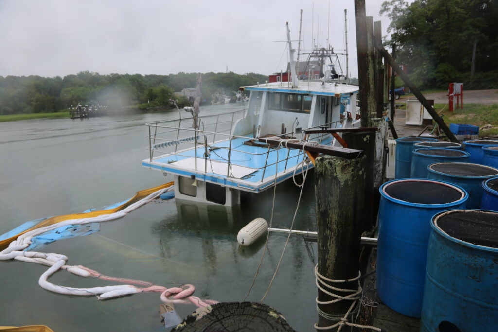 Sinking charter boat leaks fuel, poses environmental threat in Mattituck Inlet