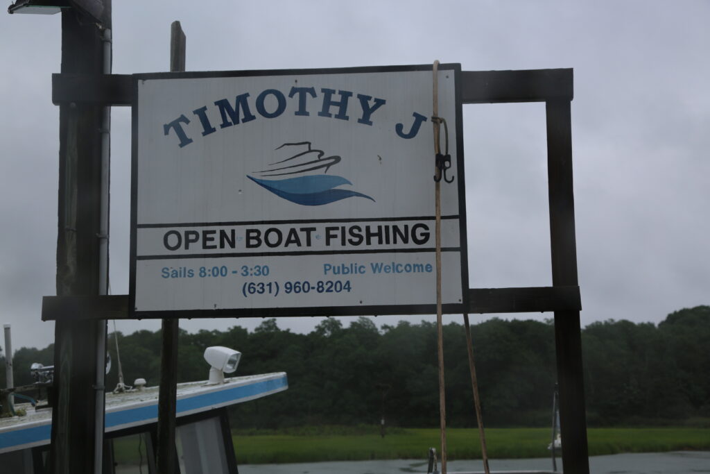 Sinking charter boat leaks fuel, poses environmental threat in Mattituck Inlet